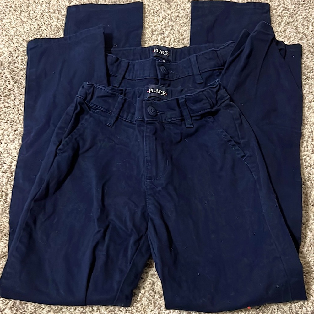 Two pairs of girls uniform pants